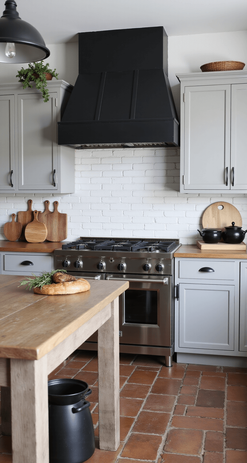 Grey Kitchen Cabinets: The Ultimate Design Guide for Modern Homes Modern farmhouse kitchen featuring medium castle grey Shaker cabinets with matte black hardware, a dramatic black range hood, a weathered wood island, industrial black pendant lights, and reclaimed brick flooring, styled with vintage breadboards, black stoneware, and dried herbs.